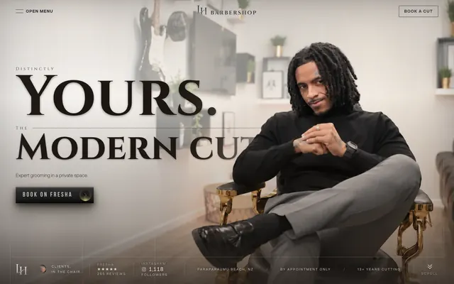 LH Barbershop hero: Leandro seated in the barber chair beside “Distinctly Yours. The Modern Cut.” and Book on Fresha