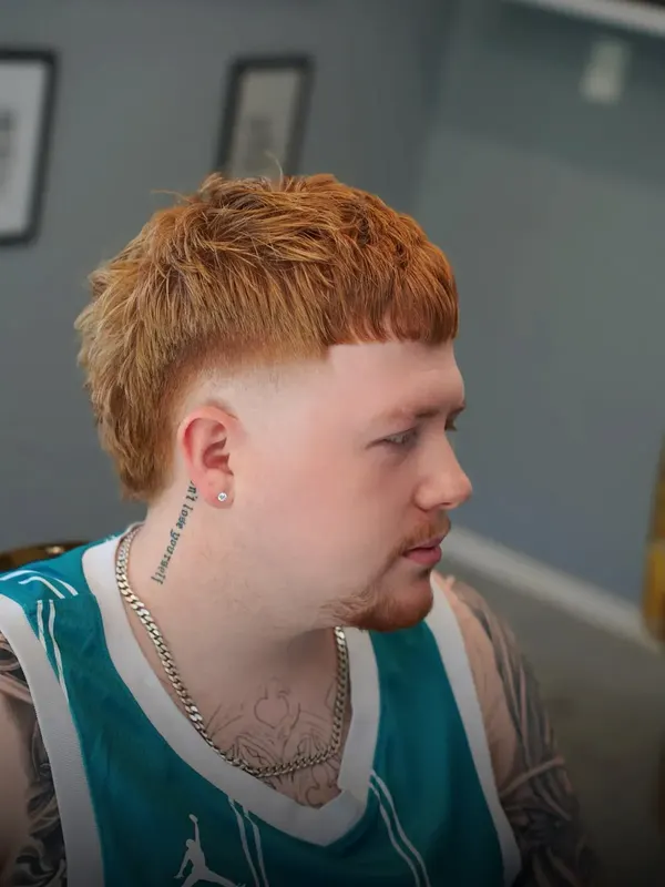 A ginger mullet with faded sides, cut by Leandro Herrera